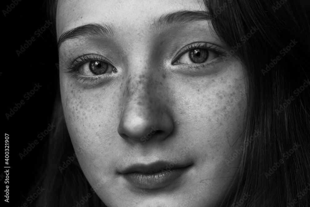 close up portrait of a young woman with freckles close up portrait of a young woman with freckles