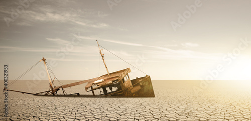 Rusty ship in a dried ocean. Concept of global warming and climate change	

