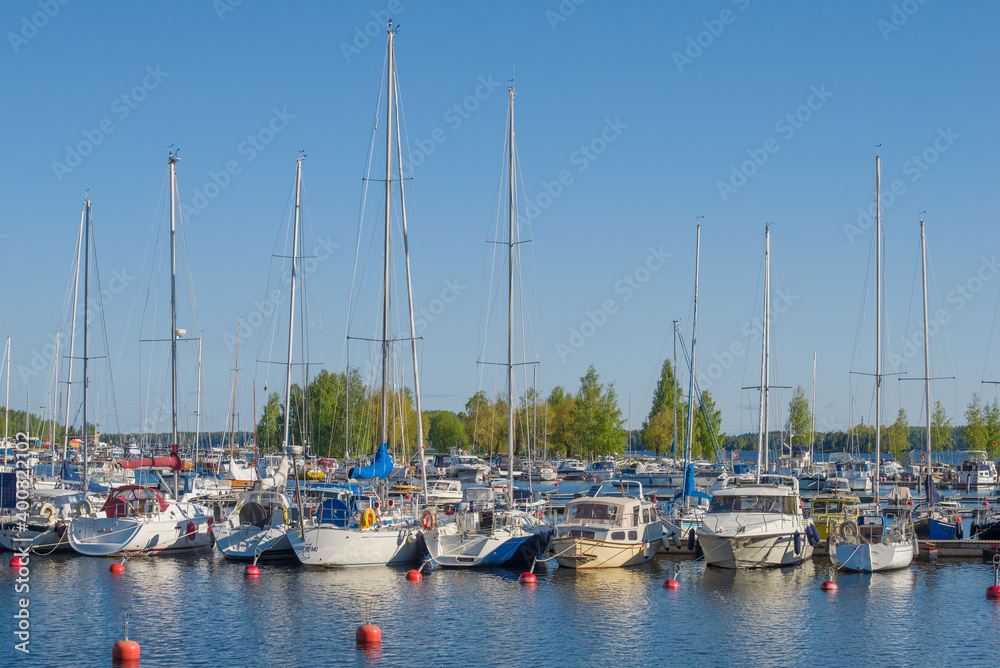 Anchorage of yachts on Lake Saimaa on a sunny June day. Finland