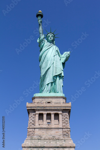 Statue of Liberty in front of blue sky