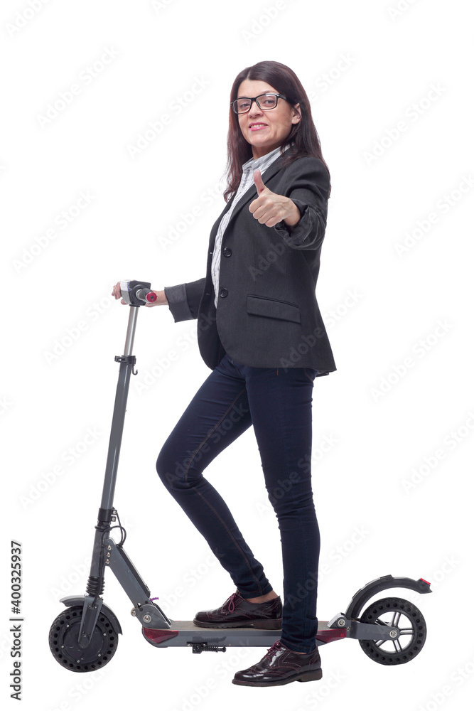 Full length portrait of a woman riding a scooter isolated on white background Full length portrait of a woman riding a scooter isolated on white background