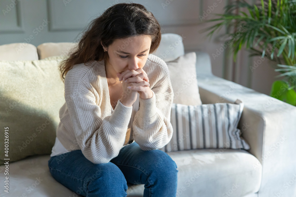 Depressed young woman on sofa at home. Depressed young woman on sofa at home.
