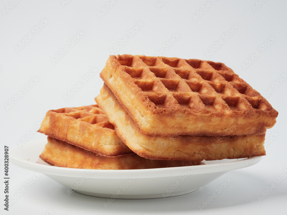 Traditional Belgian waffles isolated on white background, top view Traditional Belgian waffles isolated on white background, top view