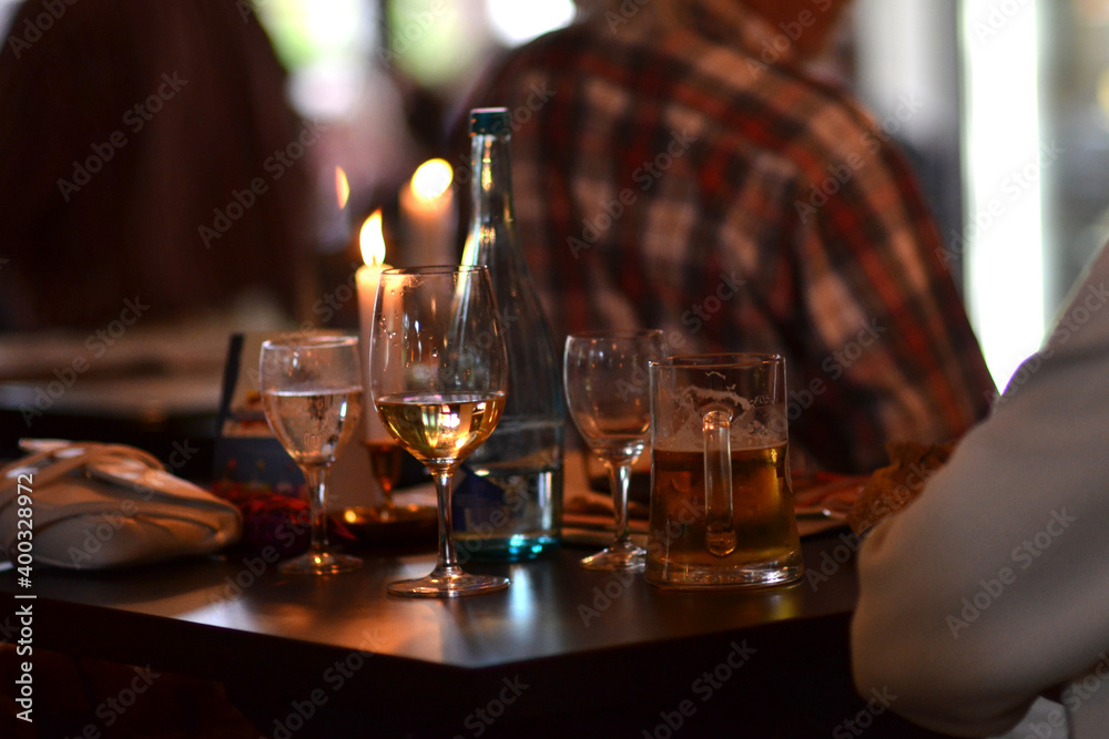 Glasses of beer and wine on a pub table