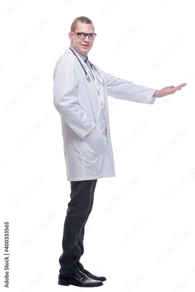 Portrait of friendly doctor pointing up studio isolated Portrait of friendly doctor pointing up studio isolated