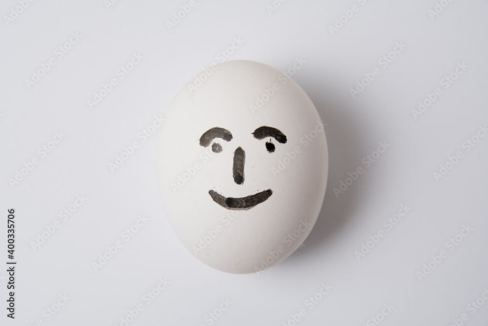 Egg with a happy and joyful person on a white background copy space. Egg with a happy and joyful person on a white background copy space.