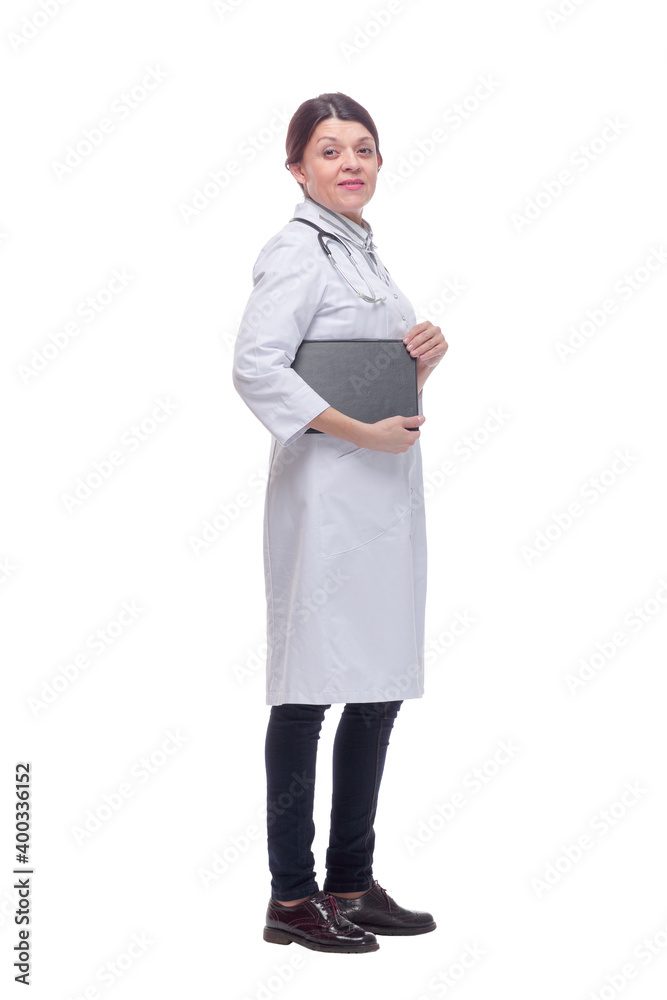 Smiling female doctor with lab coat in her office holding a clipboard with medical records Smiling female doctor with lab coat in her office holding a clipboard with medical records