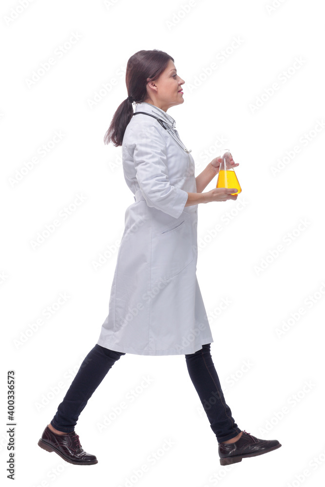 Front view of walking female scientist with beaker Front view of walking female scientist with beaker