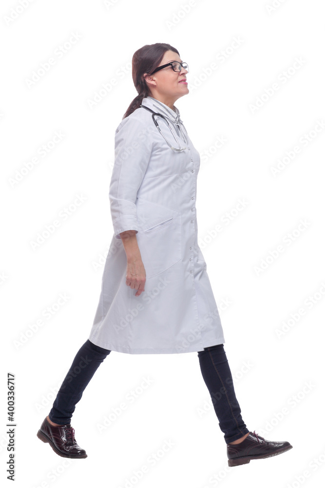 Female doctor walking towards the camera smiling isolated over a white background Female doctor walking towards the camera smiling isolated over a white background