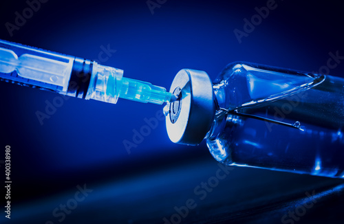 vaccine and syringe medical in blue enviroment