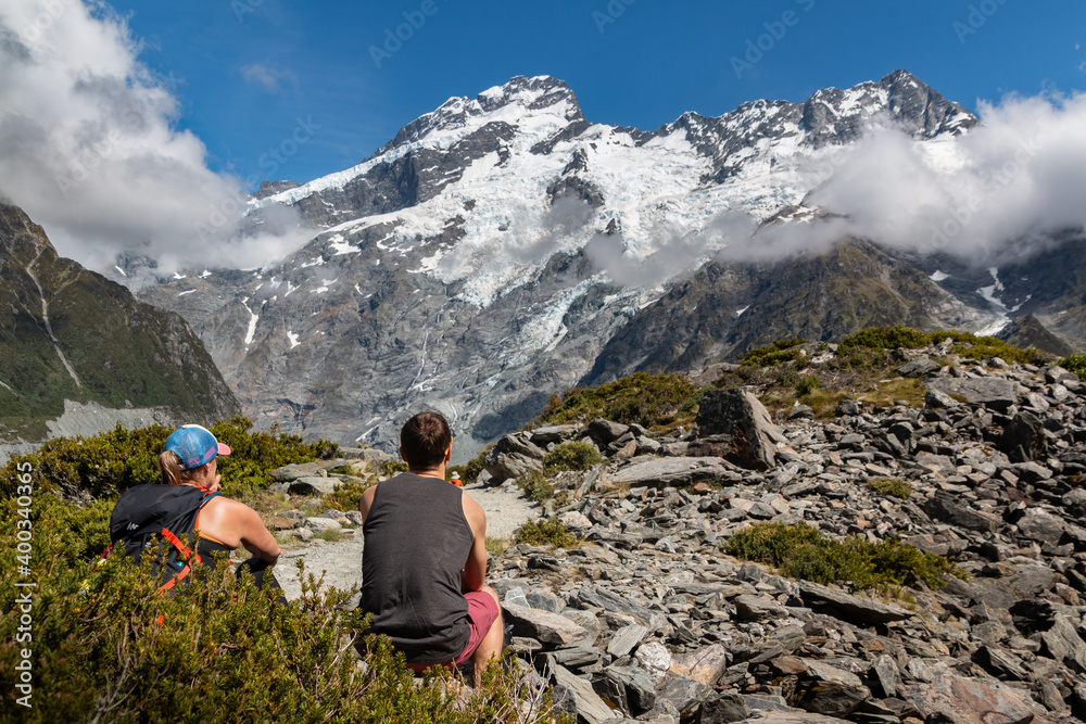 Fototapeta premium hikers taking a rest at mountains in the summer