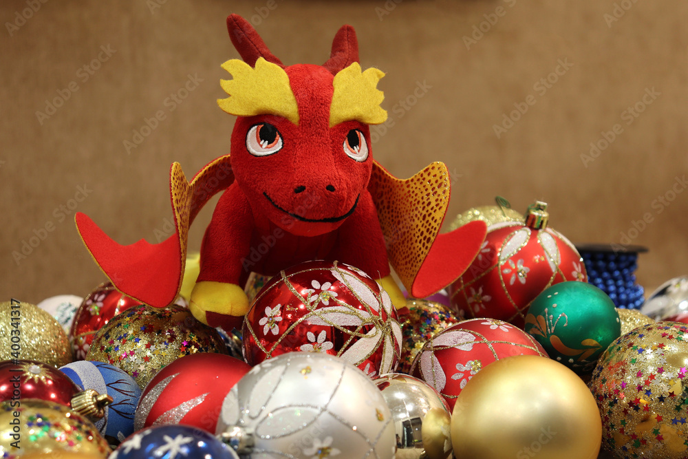 Christmas toy balls and a red dragon in a festive mood