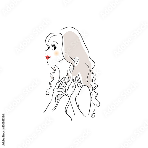 髪を巻く女性　ヘアアイロン