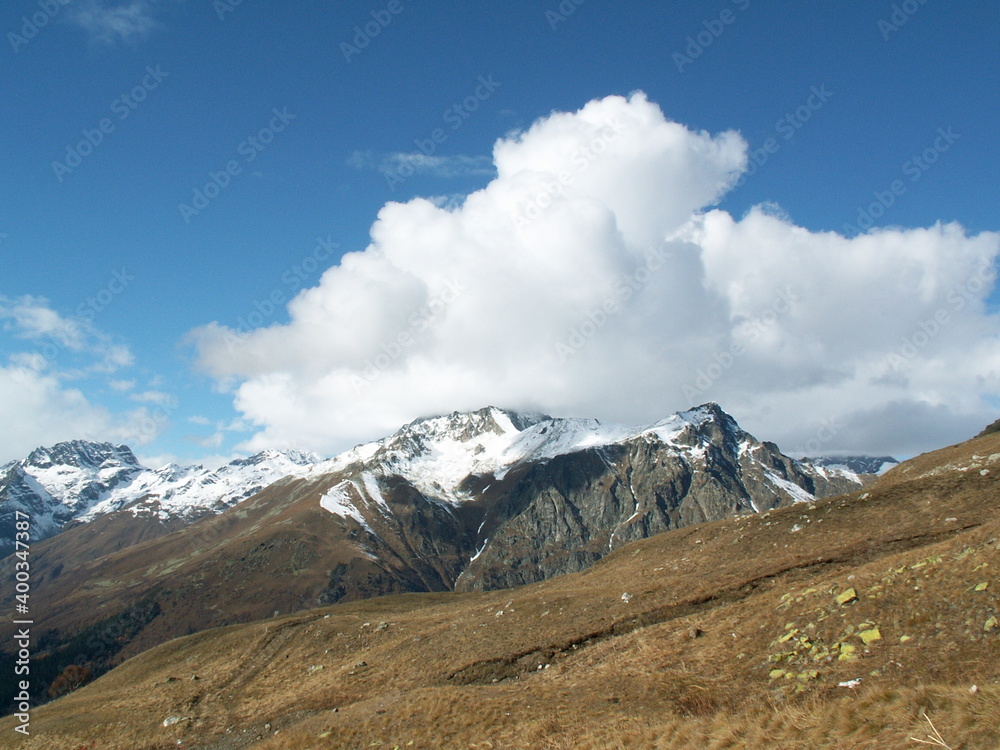 Fototapeta premium snowy mountain peaks in fog