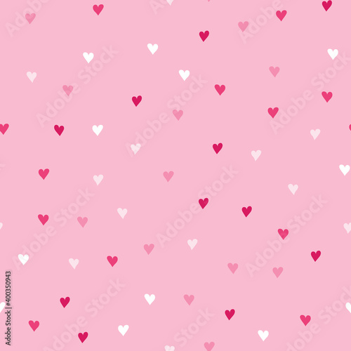 Background with different colored confetti hearts for valentine time. Seamless pattern