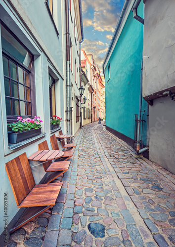 Morning in narrow medieval street in old city of Riga, Latvia, Europe