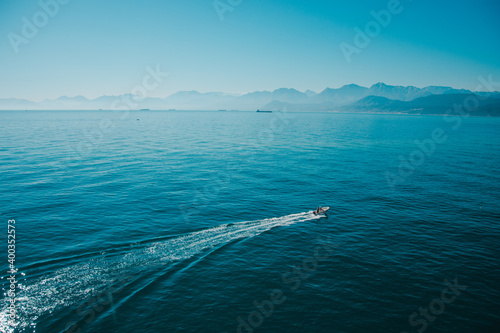 boat crossing sea water, bay of Bejaia, Algeria (ID: 400352573)