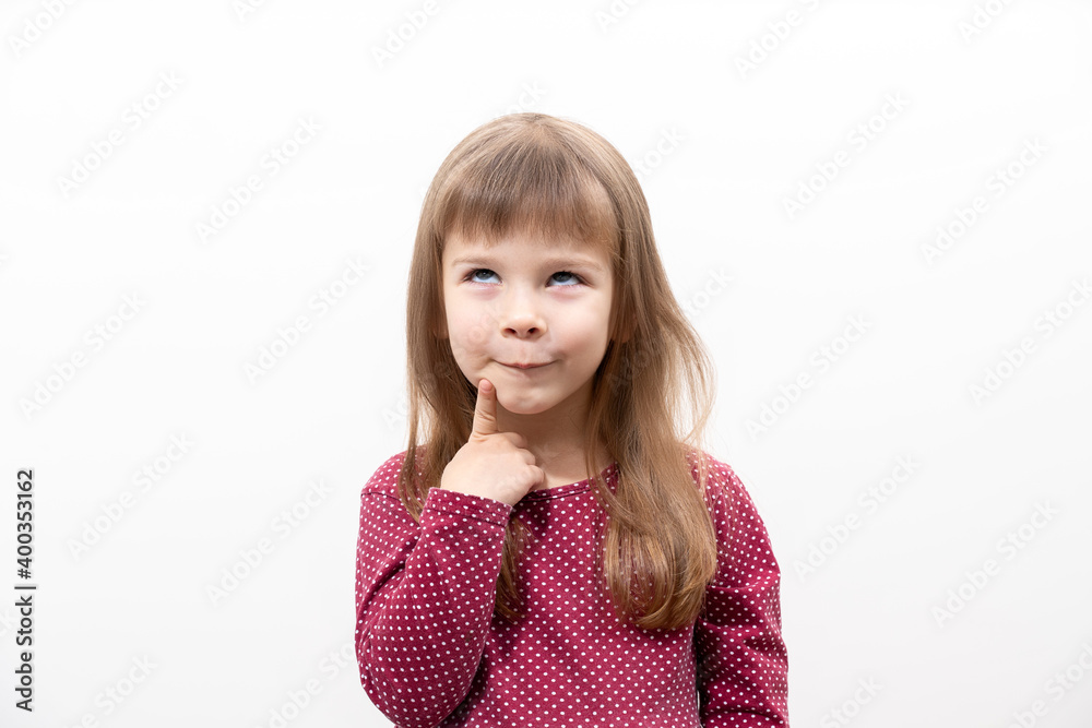 caucasian child girl in a red dress thoughtfully emotionally. children's emotions. isolate on white background caucasian child girl in a red dress thoughtfully emotionally. children's emotions. isolate on white background