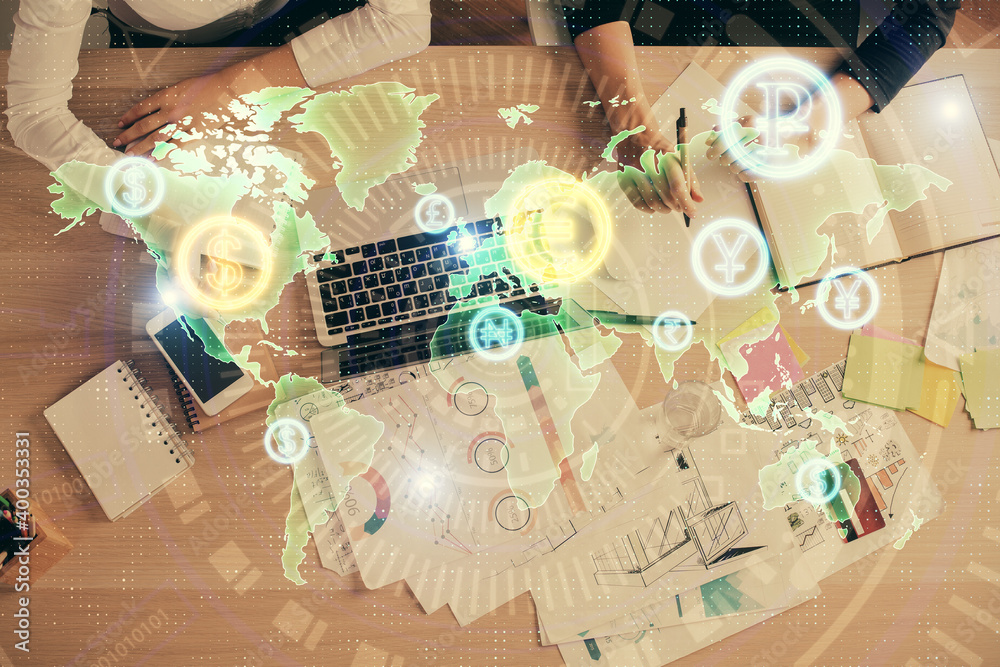 Double exposure of woman hands working on computer and forex graph hologram drawing. Top View. Financial analysis concept. Double exposure of woman hands working on computer and forex graph hologram drawing. Top View. Financial analysis concept.