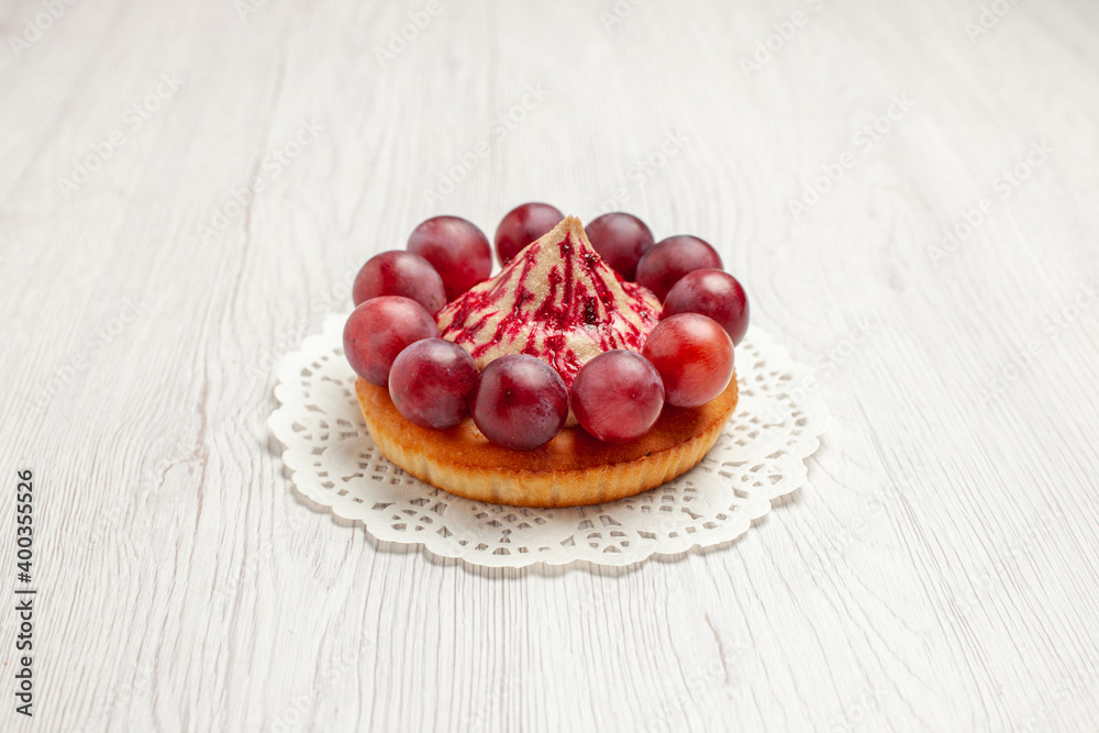 front view delicious cake with grapes on white background dessert biscuit pie front view delicious cake with grapes on white background dessert biscuit pie