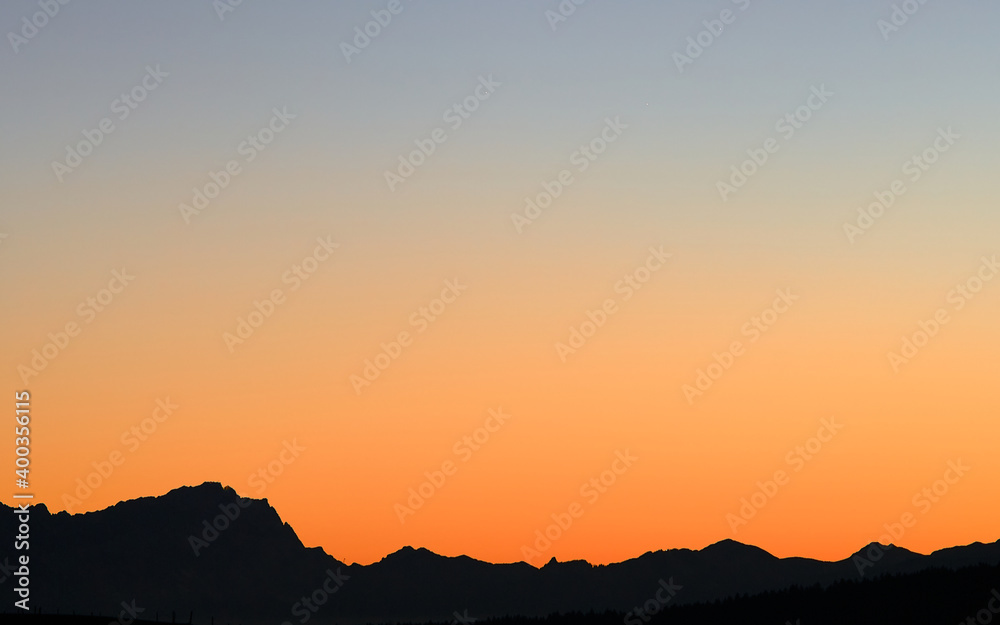 Orange Sunset with view on German Mountain Zugspitze