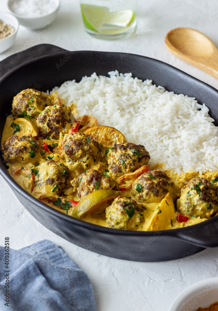 Meatballs with rice, curry sauce, lime and red pepper. Healthy eating. Meatballs with rice, curry sauce, lime and red pepper. Healthy eating.
