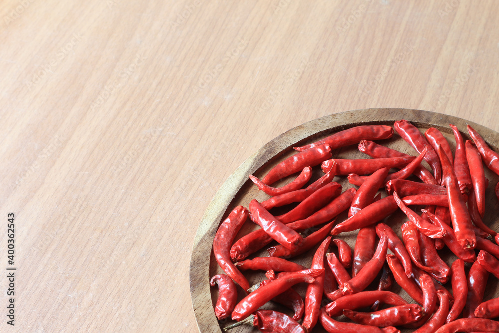 Dried chili on a wooden tray and copy space. Dried chili on a wooden tray and copy space.