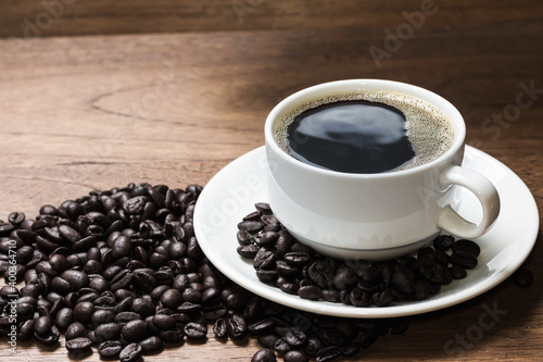 Black coffee beans on wooden