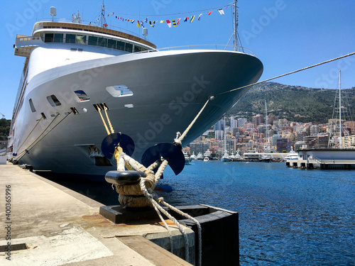 Luxury Yacht and Regent cruiseship or cruise ship liner in port of Monaco, Monte Carlo in France during summer Cote d´Azur cruising