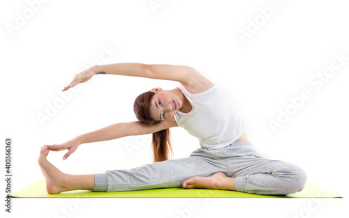 Fototapeta Naklejka Na Ścianę i Meble -  Caucasian woman practicing yoga concept of healthy life and natural balance between body and mental development on white background