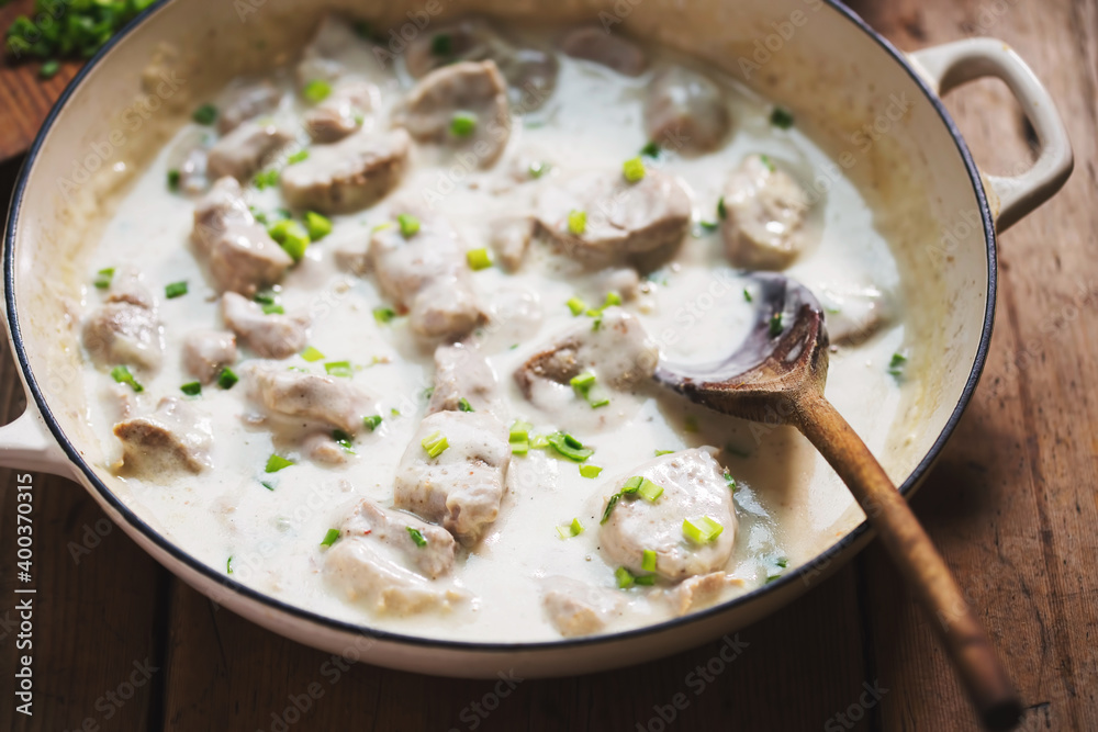 Pork tenderloin pieces in horseradish sauce with chives and mashed potatoes Pork tenderloin pieces in horseradish sauce with chives and mashed potatoes