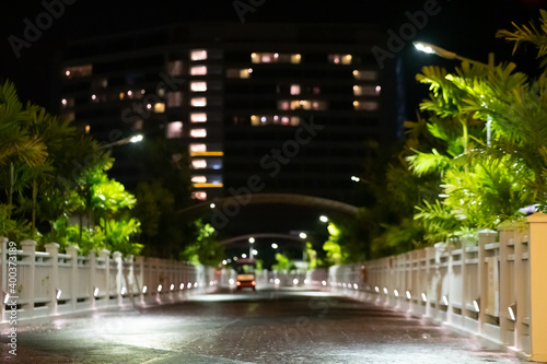 Night veiw of the street in outdoor with bokeh background. The image contain soft focus, noise and grain.