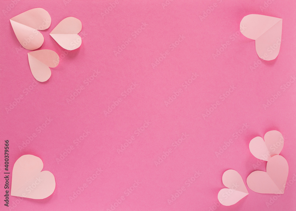 Paper pastel pink hearts on a pink background. the concept of romance, love and tenderness. Bright greeting card for Valentine's Day. Design of the anniversary of mother's Day. The view from the top.