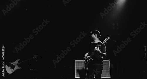 Photos Rock bassist with bass show on stage. Rock concert show set up.