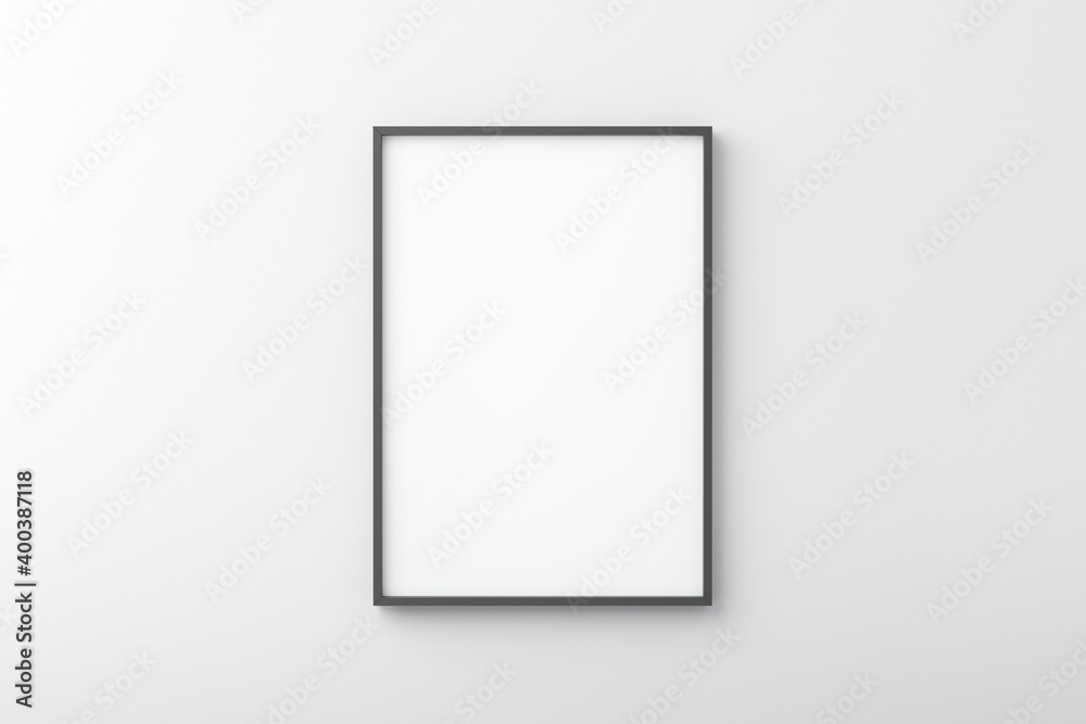 Thin black empty frame on white wall Thin black empty frame on white wall