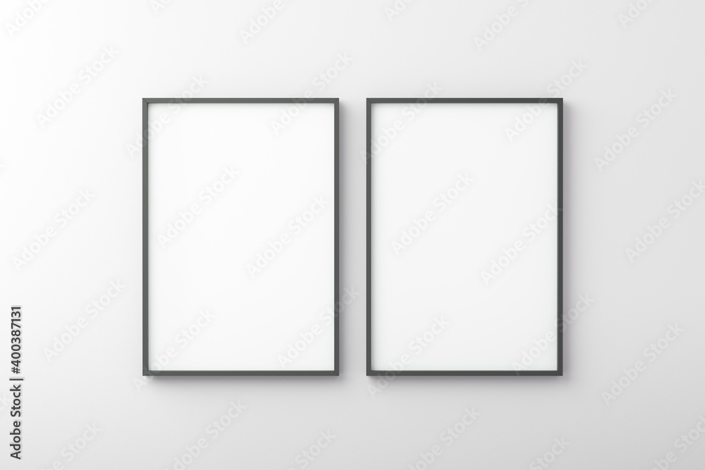 Thin black empty frame on white wall Thin black empty frame on white wall