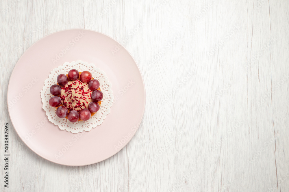top view little cake with grapes inside plate on the white background fruit dessert cake