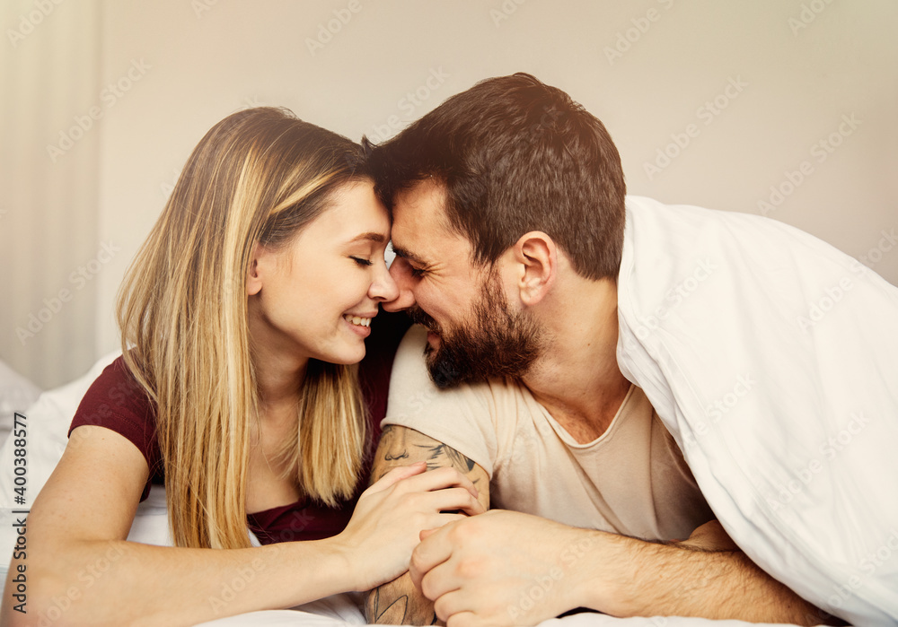couple love bedroom bed lying romance happy relationship valentine day together man woman couple love bedroom bed lying romance happy relationship valentine day together man woman