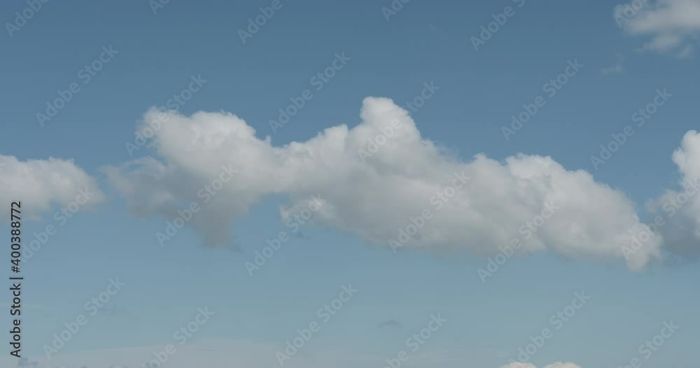 Simple white clouds over blue sky in midday Simple white clouds over blue sky in midday
