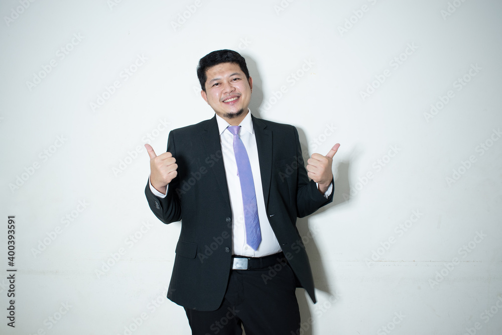 Young business man wearing a suit and tie
In a white background Young business man wearing a suit and tie
In a white background