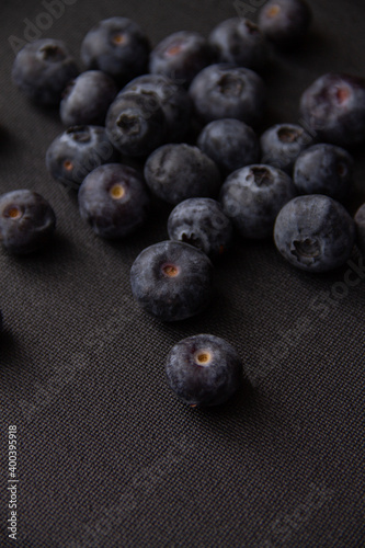 dark blue blueberries on a dark background
