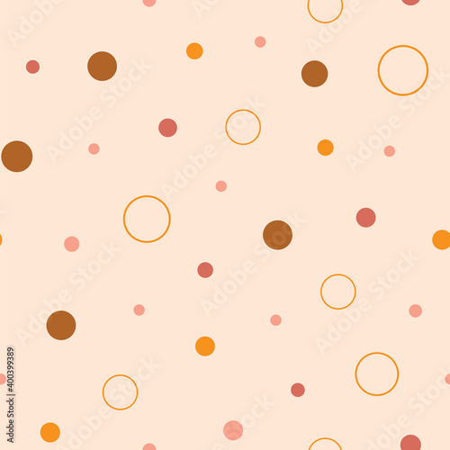 Earth tones dots and circles seamless repeat pattern. Hand-drawn dots and circles in different sizes, vector illustration.