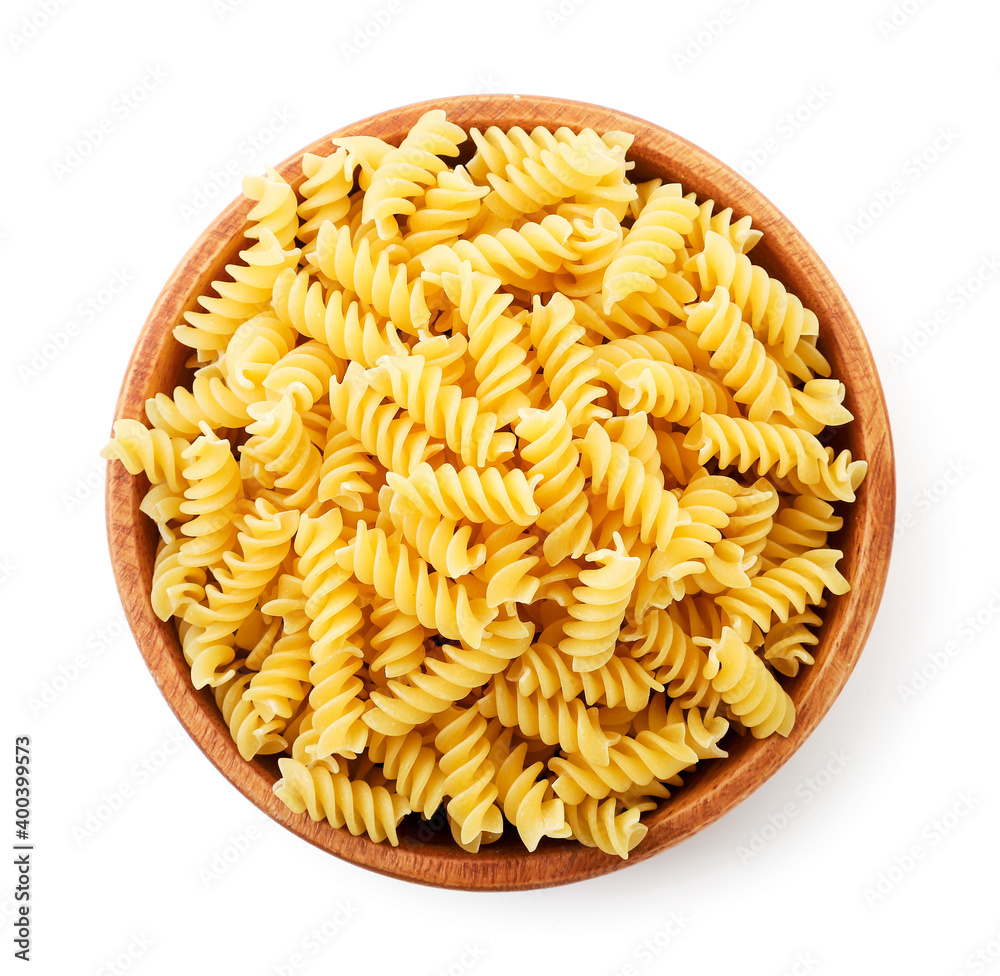 Spiral shaped pasta in a plate on a white background, isolated. The view from top Spiral shaped pasta in a plate on a white background, isolated. The view from top