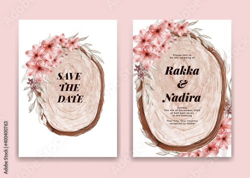 Wedding invitation card with wood slice and pink flower arrangement