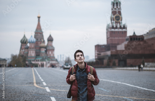 a young man travels in a Russian city