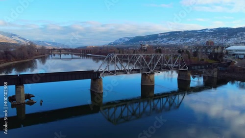 Wallpaper Mural Railway bridge over the river at dawn with mountains in the background. Torontodigital.ca