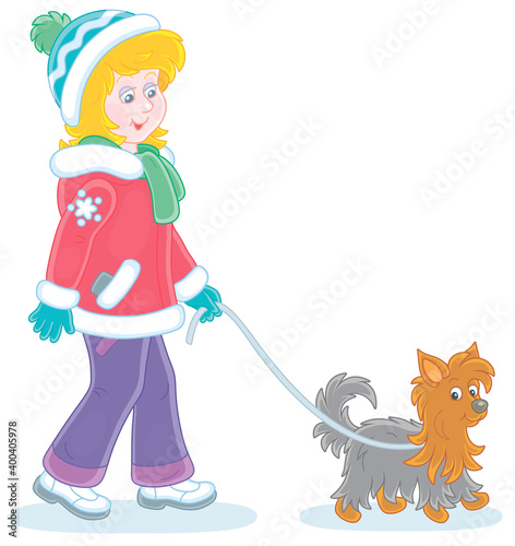 Girl in colorful winter clothes walking her small shaggy dog, vector cartoon illustration on a white background photo