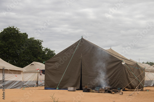 Refugee camp (IDP - Internal displaced persons) taking refuge from armed conflict between opposition groups and government. Very poor living conditions, lack of water, hygiene, shelter and food photo