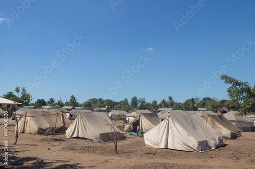 Refugee camp made of tents, people living in very poor conditions, lack of clean water, access to health photo