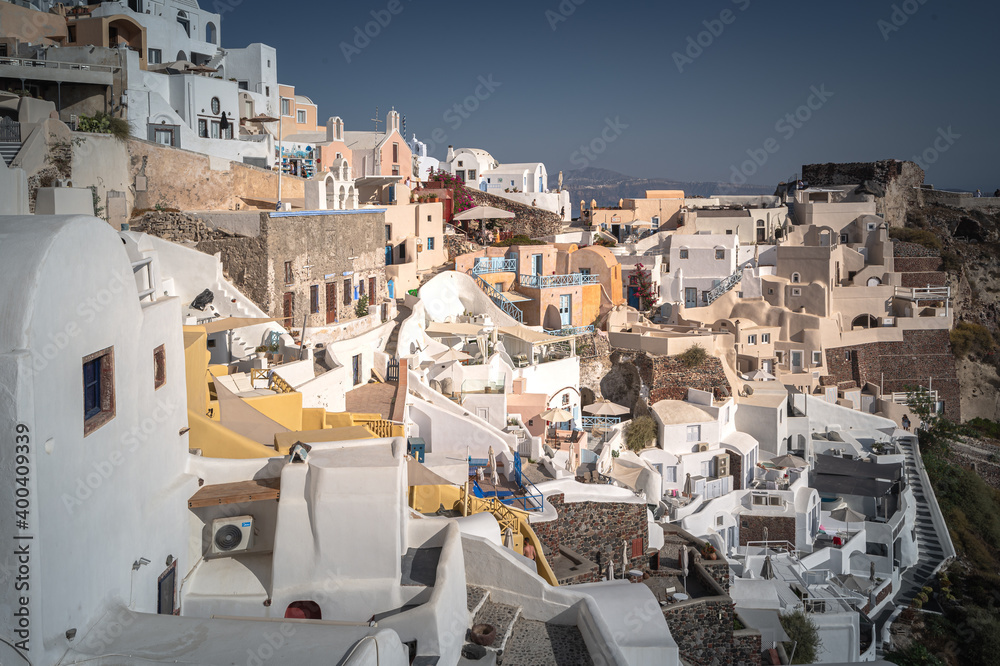 Greece Traveling. View of Greek Traditional Colorful Houses and Windmills of Oia or Ia at Santorini Island in Greece